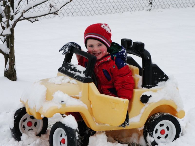 Child in push car stuck in snow